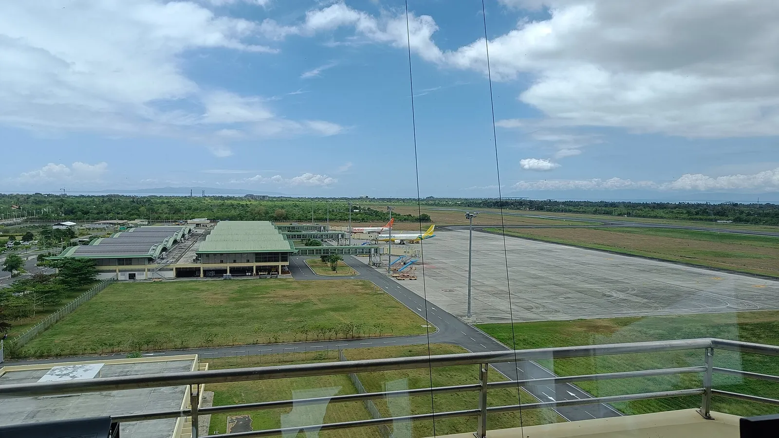 The apron and terminal roofs of Bohol–Panglao International Airport seen from the control tower