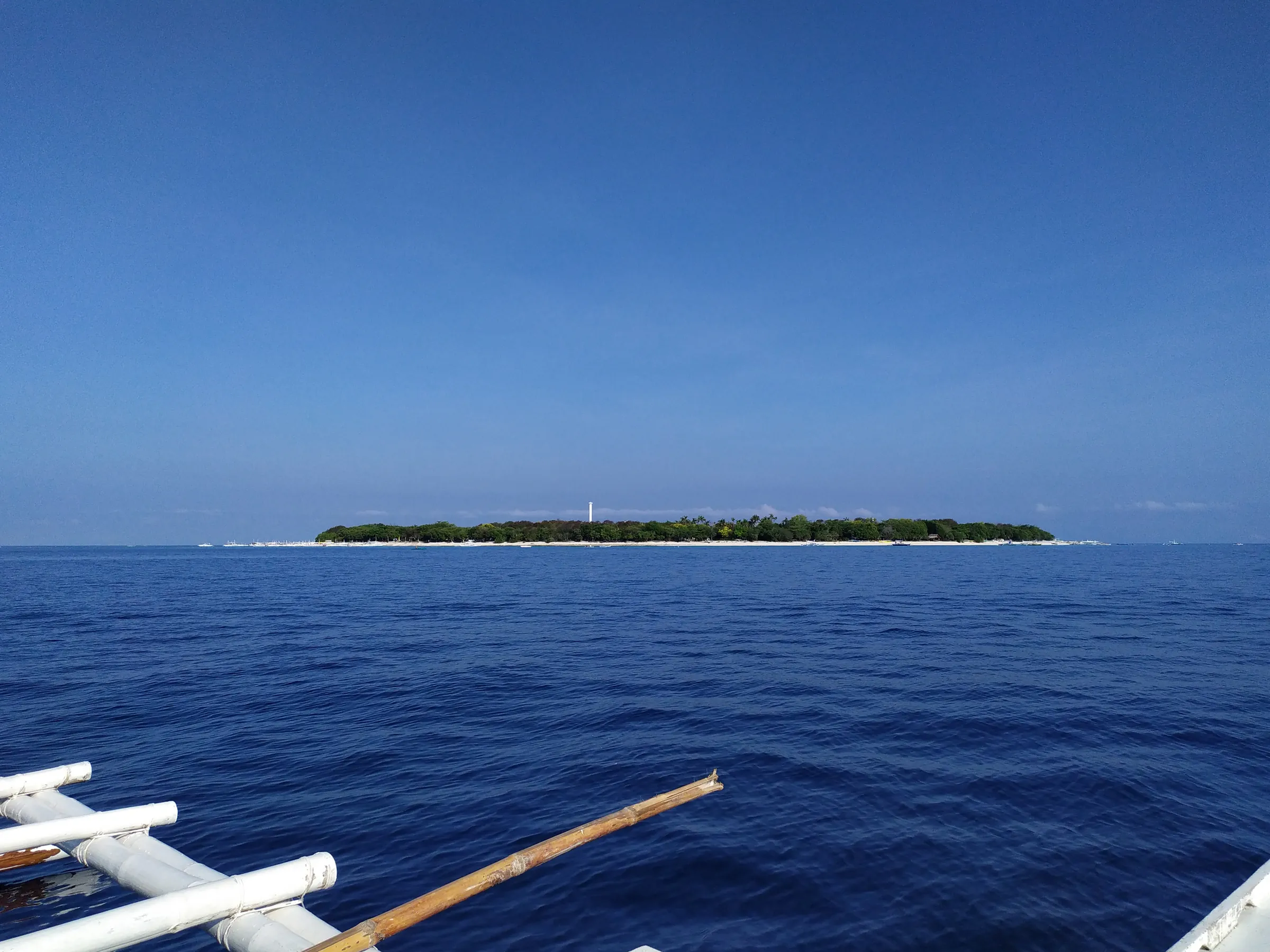 Balicasag Island on the horizon, seen from a bangka